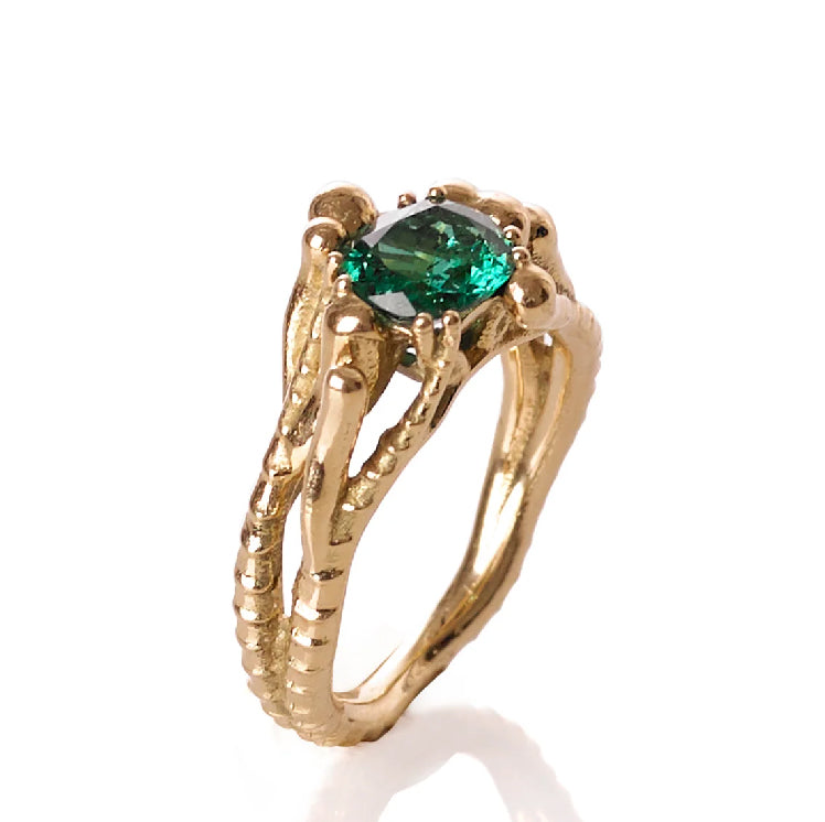 Elegant Sable Emerald Ring featuring a cushion-cut Zambian emerald set in 18K recycled gold, showcasing timeless craftsmanship and sustainable design.