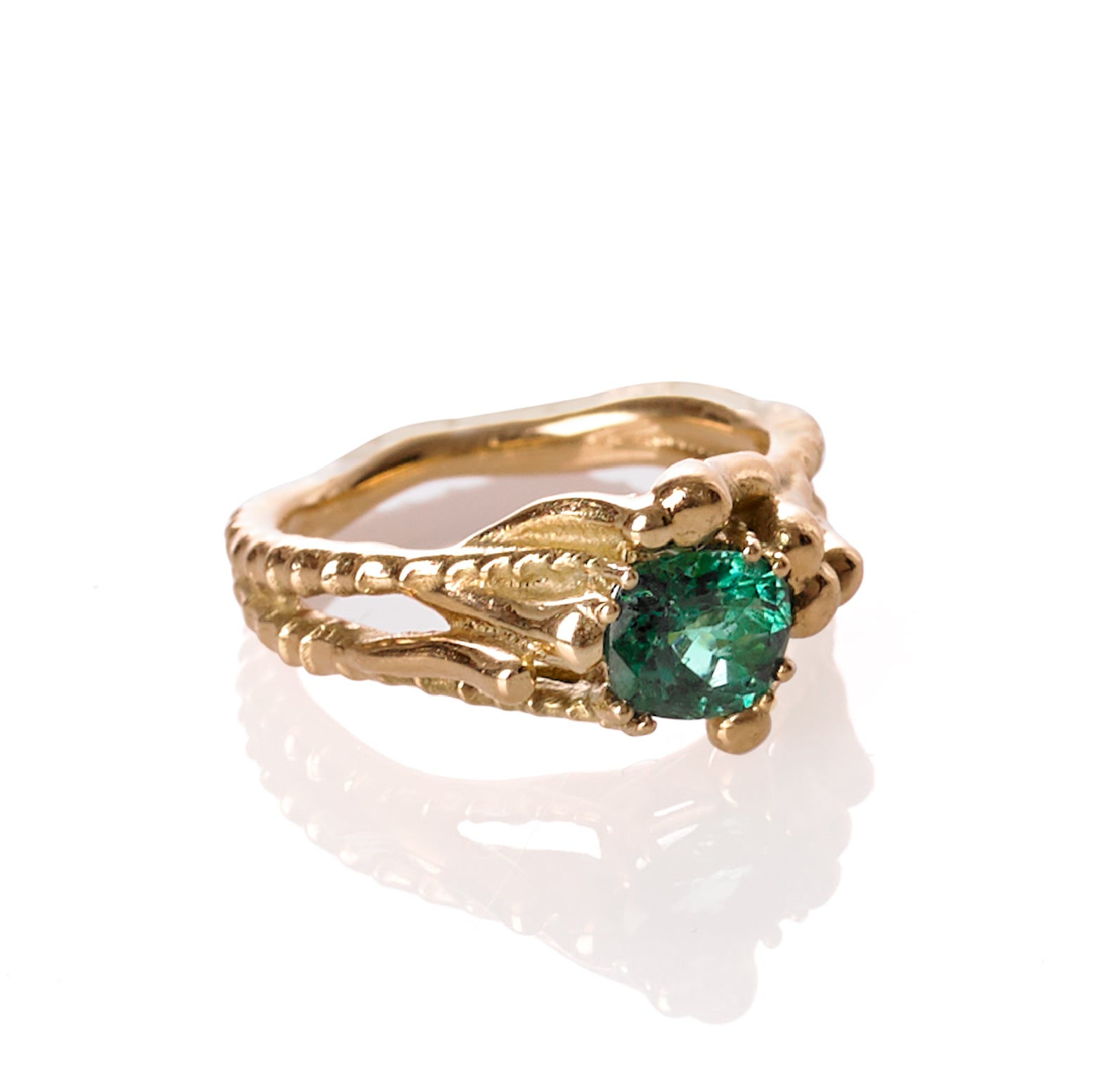 Elegant Sable Emerald Ring featuring a cushion-cut Zambian emerald set in 18K recycled gold, showcasing timeless craftsmanship and sustainable design.